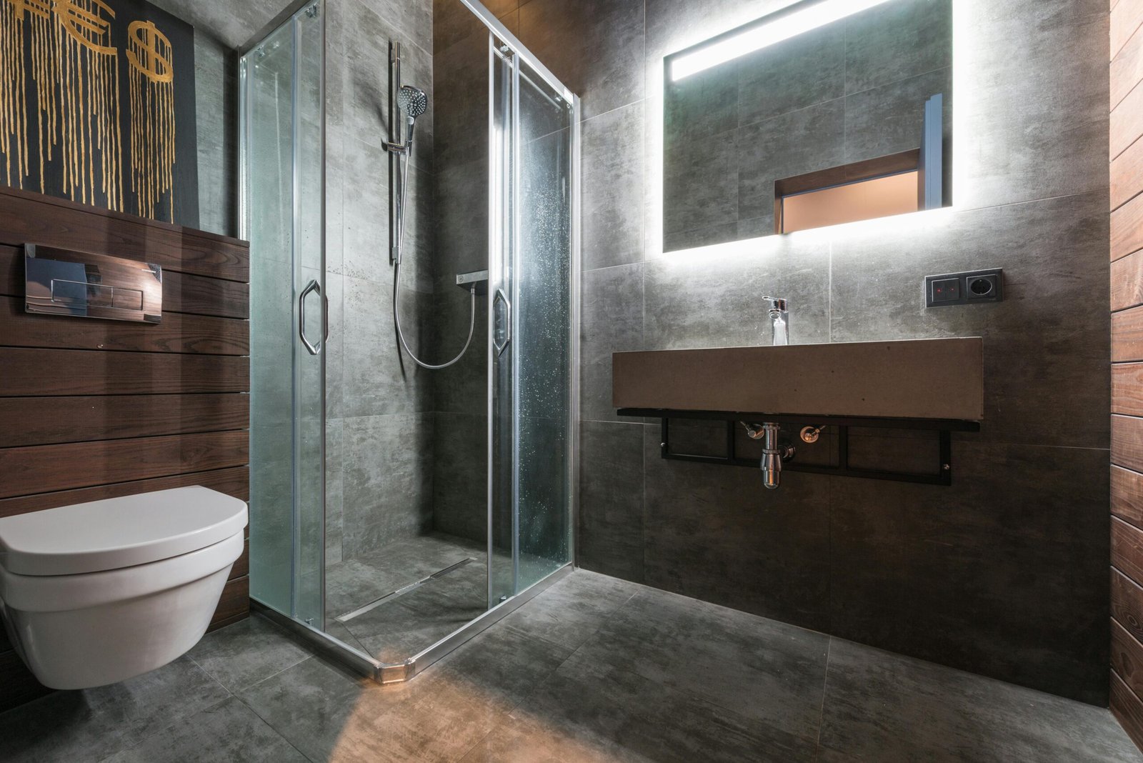 Sleek modern bathroom featuring a glass shower and elegant fixtures.